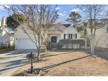 Craftsman style home with attractive landscaping and a two-car garage at 1857 Palmetto Isle Dr, Mount Pleasant, SC 29466