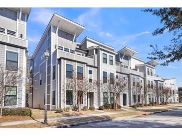 Modern townhouses with gray siding and spacious design at 4587 Summey St, North Charleston, SC 29405