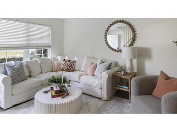 Bright living room with comfy sectional sofa and stylish coffee table at 519 Parkdale Dr # J, Charleston, SC 29414