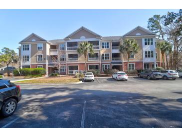 Two-story apartment building with ample parking and lush landscaping at 500 Bucksley Ln # 205, Charleston, SC 29492
