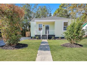 Charming light green house with white trim and a walkway at 2268 Bailey Dr, North Charleston, SC 29405