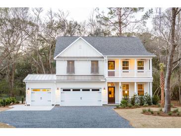 Two-story farmhouse with white siding, gray roof, and a two-car garage at 391 Wappoo Trace Ln, Summerville, SC 29486