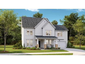 Two-story home with gray shingle roof, white siding, and brick accents at 569 Richfield Way, Summerville, SC 29486