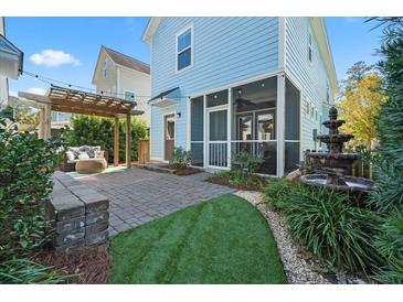 Outdoor patio with pergola, seating area, and water fountain at 103 Green Grass Rd, Summerville, SC 29483