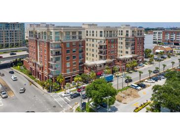 Aerial view of a modern brick building, with ample parking and city views at 150 Bee St # 318, Charleston, SC 29401