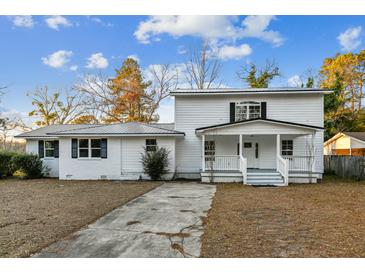 Charming two-story home with painted brick and metal roof at 213 Rose Ave, Walterboro, SC 29488