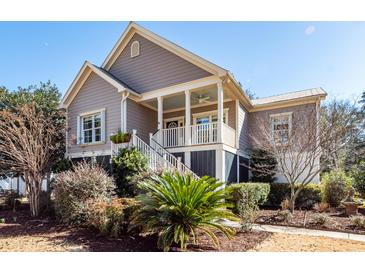 Charming two-story house with a front porch and well-manicured landscaping at 2517 Charter Oaks Dr, Mount Pleasant, SC 29466