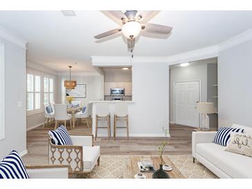 Staged living room with modern decor, open floor plan, and lots of light at 1712 Chatelain Way, Mount Pleasant, SC 29464