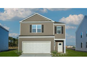 Charming two-story home with a one-car garage, set against a bright blue sky with fluffy clouds at 276 Watersglen Dr, Summerville, SC 29486