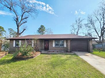 Charming single story home with a brick facade, well-manicured lawn, and an attached one car garage at 9 Grover Ln, Goose Creek, SC 29445
