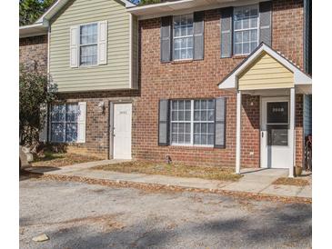 Brick townhome exterior with shuttered windows and individual unit entrances at 205 Weber Rd # B, Summerville, SC 29483