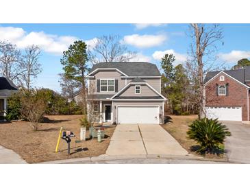 Charming two-story home with gray siding, a two-car garage, and a well-maintained front yard at 3426 Kirkwall Dr, Summerville, SC 29485