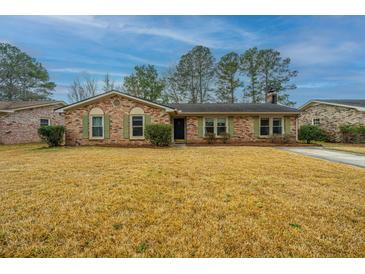 Charming brick home with green shutters and a well-maintained lawn at 111 Kennington Dr, Goose Creek, SC 29445