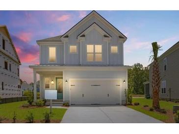 Charming two-story home featuring a two-car garage and appealing architectural details at 1724 Grovehurst Dr, Charleston, SC 29414