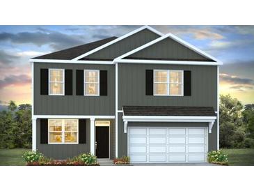 Charming two-story home with a front-entry, two car garage, and black shutters at 306 Blue Haw Dr, Moncks Corner, SC 29461