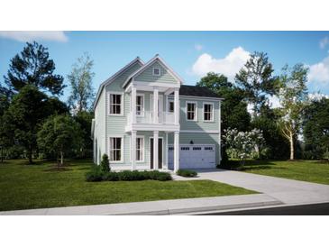 Charming two-story home with a covered porch and manicured lawn at 116 Snow St, Summerville, SC 29486