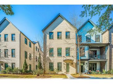 Charming three-story home boasting a light brick facade and meticulously kept landscaping at 1641 Florentia St, Mount Pleasant, SC 29464