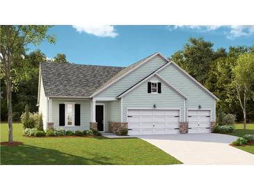 Charming single Gathering home featuring a three car garage, beautiful lawn, and stylish exterior accents at 1004 Tulip Shell, Summerville, SC 29485