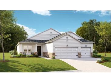 Charming single-story home featuring a three-car garage, stone accents, and a welcoming front porch at 1154 Darling St, Summerville, SC 29485