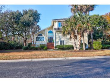 Charming two-story home with mature trees, landscaping, and a brick staircase at 1784 Omni Blvd, Mount Pleasant, SC 29466