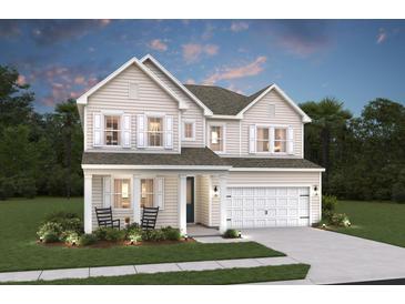Charming two-story home with light siding, white trim, two-car garage, and inviting front porch with rocking chairs at 2010 Mcguire Ln # 003, Hollywood, SC 29449