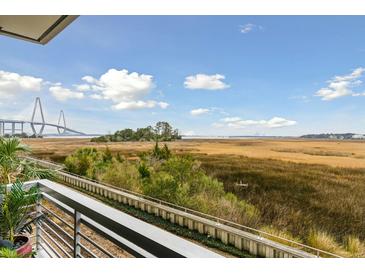 Expansive balcony view overlooking the marsh and bridge at 118 Cooper River Dr, Mount Pleasant, SC 29464