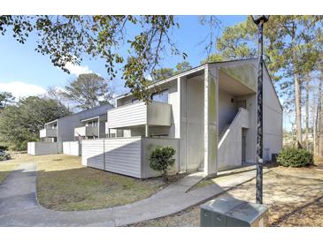 Charming multi-level condo complex with white siding and natural surroundings at 208 Greencastle Dr, Goose Creek, SC 29445