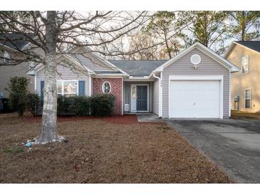 Charming one-story home featuring a single-car garage, well-maintained landscaping, and inviting curb appeal at 240 Island Green Rd, Goose Creek, SC 29445