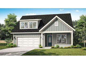 Charming single-Gathering home with a well-manicured lawn, attached garage and a pleasing grey facade at 2924 Lodge Berry Ln, Johns Island, SC 29455