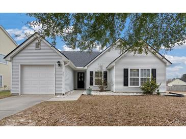 Charming single-story home with a well-maintained lawn and inviting entrance at 5051 Ballantine Dr, Summerville, SC 29485