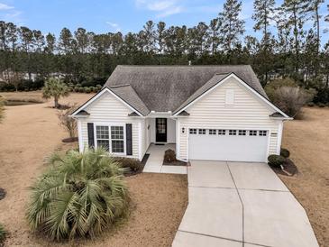 Charming single Gathering home featuring a two car garage, manicured lawn, and neutral color scheme at 714 Battery Edge Dr, Summerville, SC 29486