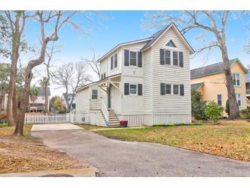 Charming two-story home featuring a well-manicured front yard and a private driveway at 783 Lake Frances Dr, Charleston, SC 29412