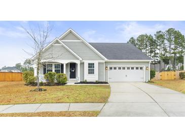 Charming single Gathering home boasting a manicured lawn, two car garage, and craftsman style architecture at 106 Terrapin Cir, Summerville, SC 29483