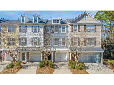 Charming townhomes featuring attached garages and well-maintained landscaping in a desirable community at 196 Fair Sailing Rd # 25, Mount Pleasant, SC 29466