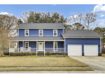 Charming two-story home featuring a welcoming front porch and a two-car garage at 102 Eastover Cir, Summerville, SC 29483