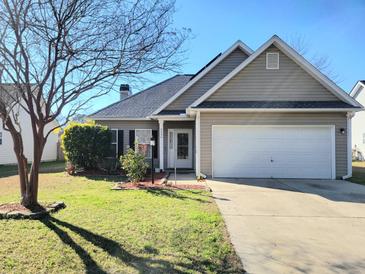 Charming single-story home with neutral siding, well-kept lawn, and attached two-car garage at 236 Highwoods Plantation Ave, Summerville, SC 29485