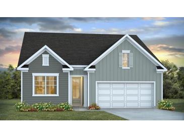 Charming, two-story home with gray siding, white trim, a white garage door and a well-manicured lawn at 332 Dickerson Ln, Lincolnville, SC 29485