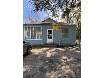 Charming single-story building featuring a blue painted exterior and a well-maintained front yard at 2157 Dorchester Rd, North Charleston, SC 29405