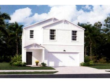 Charming two-story home with white siding, attached garage and well-maintained landscaping at 306 Pine Crest View Dr, Summerville, SC 29486
