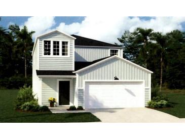 Charming two-story home with attached garage, manicured lawn and inviting curb appeal at 308 Pine Crest View Dr, Summerville, SC 29486
