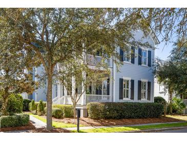 Charming two-story home boasts manicured landscaping, classic shutters, and inviting front porch at 914 Tupelo Bay Dr, Mount Pleasant, SC 29464
