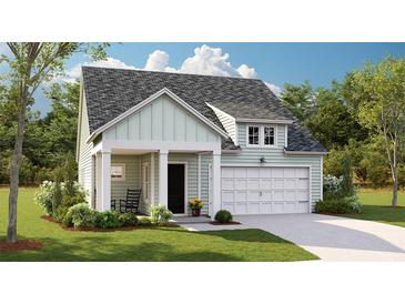 Charming single-Gathering home showcasing manicured lawn, inviting entrance, and attached garage for convenient parking and storage at 118 Threaded Fern St, Summerville, SC 29485
