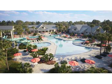 Expansive community pool area with slides, ample seating, and lush tropical landscaping for resort-style living at 972 Carnes Crossing Blvd, Summerville, SC 29486