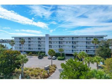Beautiful view of the Twin Rivers Condominiums with well maintained landscaping and plenty of parking space at 2395 Folly Road # 4H, Folly Beach, SC 29439