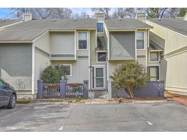 Charming townhome featuring a well maintained facade, complemented by mature landscaping and convenient parking at 2765 Jobee Dr # 1304, Charleston, SC 29414