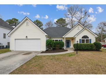 Charming single-story home features a well-maintained yard, attached garage, and welcoming entrance at 8153 Governors Walk, North Charleston, SC 29418