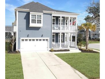 Charming two-story home featuring a double porch, white trim, and a well-manicured front yard at 1020 Lyle Way, Mount Pleasant, SC 29466