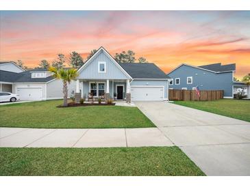 Charming single-Gathering home with a manicured lawn and a classic blue exterior at 114 Belfort Pl, Summerville, SC 29486