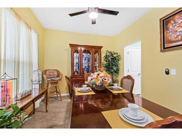 Bright dining room features traditional furniture, floral arrangement, and elegant accents at 1227 Cosmos Rd, Summerville, SC 29483