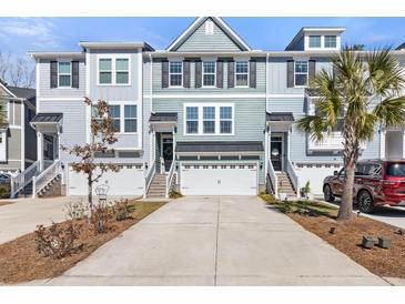 Charming multi-level townhome with attached garages and well-manicured landscaping at 1549 Moss Spring Rd, Mount Pleasant, SC 29466